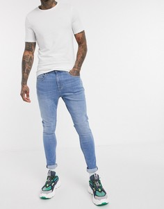 Светлые супероблегающие джинсы Tommy Jeans эксклюзивно для ASOS-Голубой