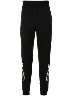 A BATHING APE® спортивные брюки с камуфляжным принтом