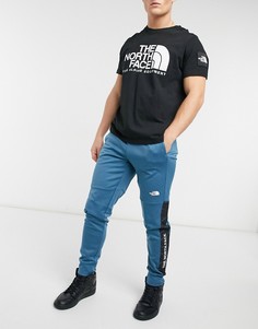 Синие джоггеры с логотипом и манжетами The North Face Train N-Голубой