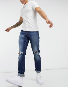 Темно-синие узкие эластичные джинсы с рваными коленями ASOS DESIGN-Голубой