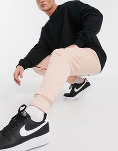 Розовые зауженные джоггеры с прошитой стрелкой ASOS DESIGN-Розовый