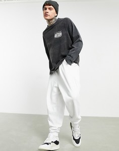 Oversized-футболка черного выбеленного цвета с длинными рукавами и принтом на груди ASOS DESIGN-Черный
