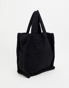 Черная сумка-тоут из искусственного меха с наплечным ремешком и короткой ручкой ASOS DESIGN-Черный цвет
