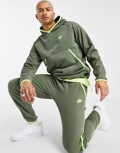 Джоггеры цвета хаки со вставками и манжетами Nike Club Essentials-Зеленый