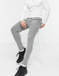 Зауженные джоггеры из фактурной ткани с фиксированной кромкой ASOS DESIGN-Черный цвет