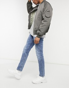 Синие узкие джинсы стретч из органического выбеленного денима в винтажном стиле ASOS DESIGN-Голубой