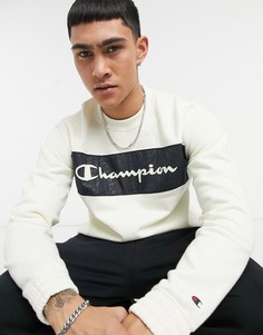 Желтовато-белый свитшот с круглым вырезом и темно-синим принтом Champion