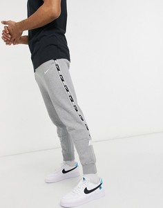 Серые джоггеры с манжетами и лентой Nike Repeat Pack-Серый