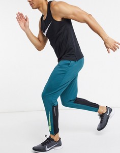 Бирюзовые джоггеры Nike Running Wild Run-Зеленый цвет