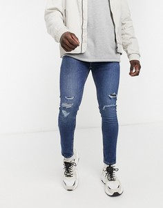 Узкие, суженные книзу джинсы с потертостями Levis Youth 512-Голубой Levis®