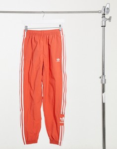Красные спортивные штаны из нейлона adidas Originals-Красный
