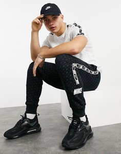 Черные джоггеры с манжетами и сплошным принтом логотипа на лентах Nike Repeat Pack-Черный цвет