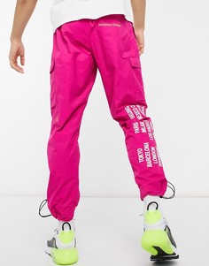 Розовые текстильные джоггеры карго с манжетами и надписями Nike World Tour Pack-Розовый цвет