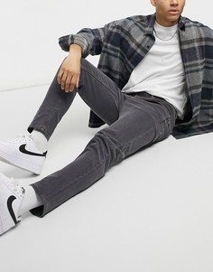 Черные выбеленные суженные книзу джинсы ASOS DESIGN-Черный цвет