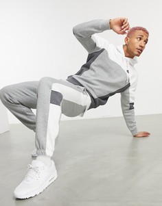 Джоггеры в стиле колор блок темно-серого цвета с манжетами Nike-Серый
