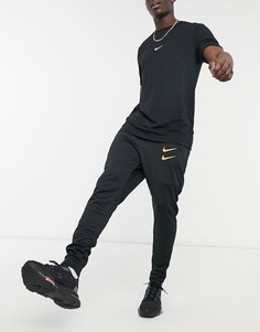 Черные джоггеры с золотистым логотипом-галочкой Nike-Черный цвет