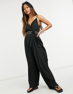 Черный комбинезон с глубоким вырезом и декоративной отделкой на поясе River Island