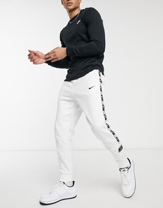 Белые джоггеры с манжетами, тесьмой и сплошным логотипом Nike Repeat Pack-Белый