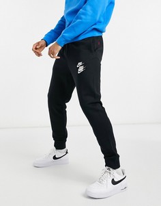 Джоггеры черного цвета с манжетами Nike World Tour Pack-Черный цвет