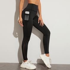 Спортивные леггинсы с карманом и сетчатой вставкой Shein