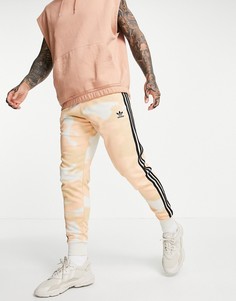 Кремовые джоггеры с камуфляжным принтом adidas Originals-Белый