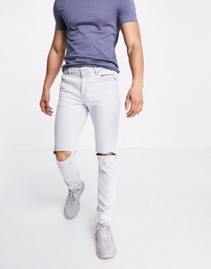 Светло-голубые узкие эластичные джинсы с рваными коленями ASOS DESIGN-Голубой