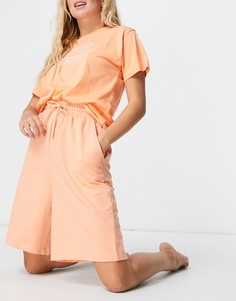 Удлиненные трикотажные шорты оранжевого цвета ASOS DESIGN-Оранжевый цвет