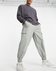 Зеленые суженные книзу oversized-брюки с карманами карго ASOS DESIGN-Зеленый цвет
