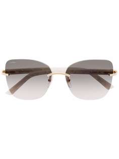 Cartier Eyewear солнцезащитные очки в безободковой оправе