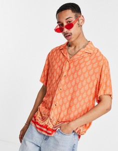 Свободная оранжевая рубашка с отложным воротником, принтом пейсли и каймой по нижнему краю ASOS DESIGN-Оранжевый цвет