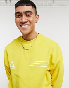 Желтый oversized-свитшот с логотипами на груди ASOS Unrvlld Spply