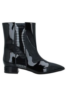 Полусапоги и высокие ботинки Moschino