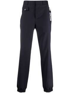 Moschino logo-keyring trousers
