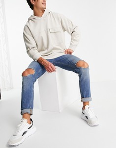 Голубые выбеленные джинсы скинни со рваной отделкой на коленях ASOS DESIGN-Голубой