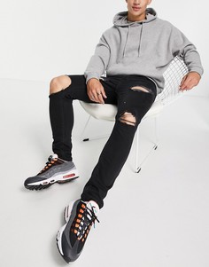 Черные зауженные джинсы со рваной отделкой и необработанными краями ASOS DESIGN-Черный цвет