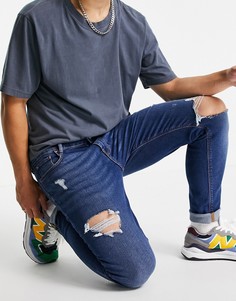 Темно-выбеленные зауженные джинсы со рваной отделкой ASOS DESIGN-Голубой