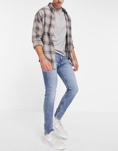 Синие супероблегающие джинсы с подворотами Levis 519-Голубой Levis®