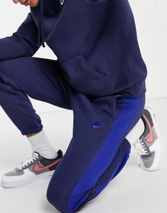 Темно-синие джоггеры с манжетами и ярко-синими вставками Nike-Темно-синий