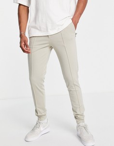 Строгие трикотажные зауженные брюки светло-бежевого цвета с манжетами ASOS DESIGN-Светло-бежевый цвет