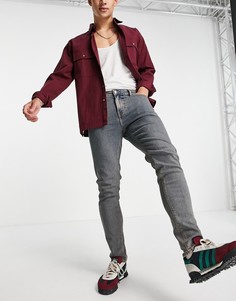 Выбеленные тонированные зауженные джинсы ASOS DESIGN-Голубой