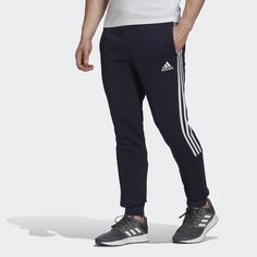 Брюки Essentials Fleece Tapered Cuff 3-Stripes adidas Sportswear