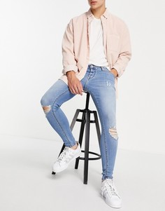 Голубые супероблегающие эластичные джинсы со рваными коленями ASOS DESIGN-Голубой