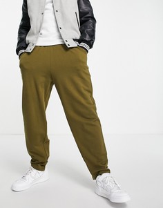 Зеленые oversized-джоггеры из органического хлопка с ремешками на щиколотках ASOS DESIGN-Зеленый цвет