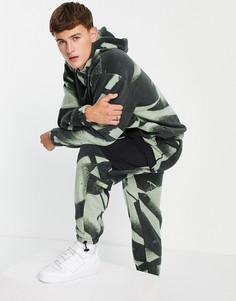 Флисовые oversized-джоггеры со сплошным камуфляжным принтом от комплекта ASOS DESIGN-Разноцветный