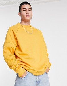 Желтый oversized-свитшот из органического хлопка с отделочными швами на рукавах ASOS DESIGN
