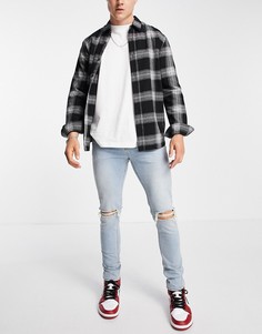 Голубые выбеленные джинсы скинни со рваной отделкой на коленях ASOS DESIGN-Голубой
