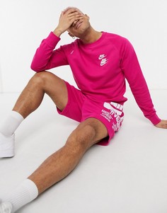 Розовый свитшот с круглым вырезом и графическим принтом Nike World Tour Pack-Розовый цвет