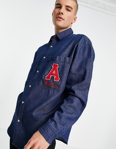 Oversized-рубашка в стиле 90-х из денима со сплошным принтом и нашивкой с вышивкой ASOS DESIGN-Голубой