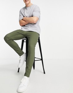 Зеленые выбеленные брюки чиносы супероблегающего кроя ASOS DESIGN-Зеленый цвет