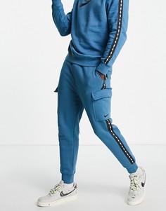 Голубые джоггеры в стиле карго с отделкой тесьмой с повторяющимся логотипом Nike-Голубой